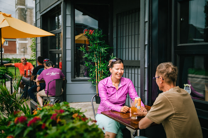 People sitting outside of café